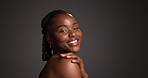 Portrait, laugh and woman with glow, skincare and natural cosmetics for healthy skin or mockup space. Gray background, happy black person and shine with dermatology, self care and studio in Nigeria