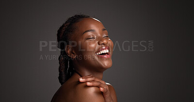Buy stock photo Beauty, skincare or African woman laughing in studio, wellness shine or healthy glow for facial cosmetic. Self care, mockup space or person with dermatology, smile or flawless skin on dark background