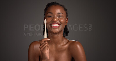 Buy stock photo Black woman, bamboo toothbrush and portrait in studio, oral hygiene and mockup space on dark background. African person, wood brush and smile with sustainable product for dental wellness in Nigeria