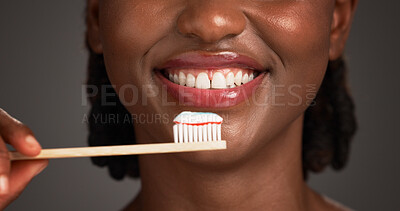 Buy stock photo Happy woman, mouth and teeth with toothbrush in studio for dental hygiene on a gray background. Closeup, female person or model with smile, bamboo stick or paste for oral health, gum care or wellness