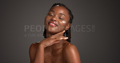 Buy stock photo Space, face cream and black woman in studio for skincare, facial and natural beauty on dark background. Mockup, dermatology and person with lotion, moisturizer and cosmetics for glow, shine or health