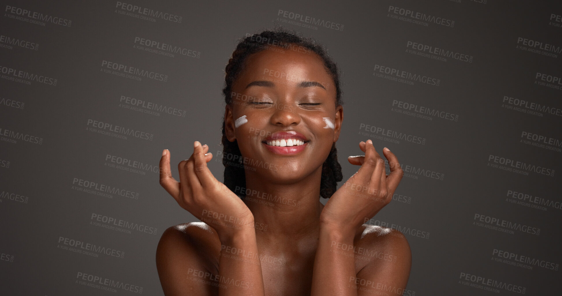 Buy stock photo Happy, black woman and studio with face cream for skincare or moisturizer on a gray background. Female person, model or smile with lotion, SPF or beauty cosmetics for anti aging skin on mockup space
