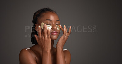 Buy stock photo Space, skincare and black woman in studio with eye mask for anti aging, dark circles and wellness. Mockup, dermatology and person with patches for circulation, hydration and beauty on gray background