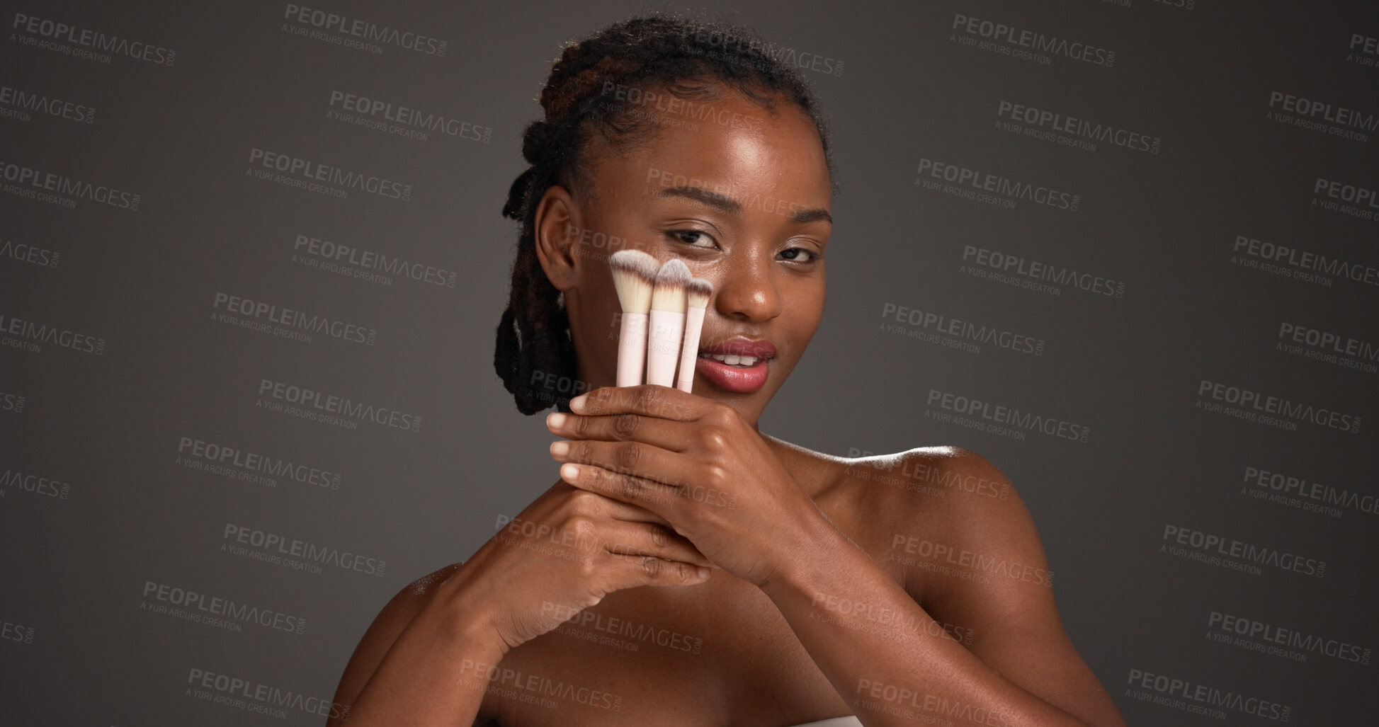Buy stock photo Brush, makeup and portrait of black woman in studio for cosmetics, makeover and application. Cosmetology, space and person with tools for foundation, beauty products and aesthetic on dark background