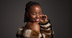 Luxury skincare, beauty and happy black woman in studio with glow, self care and glamour. Makeup, cosmetics and model with fur coat for aesthetic, healthy skin or dermatology on dark background space