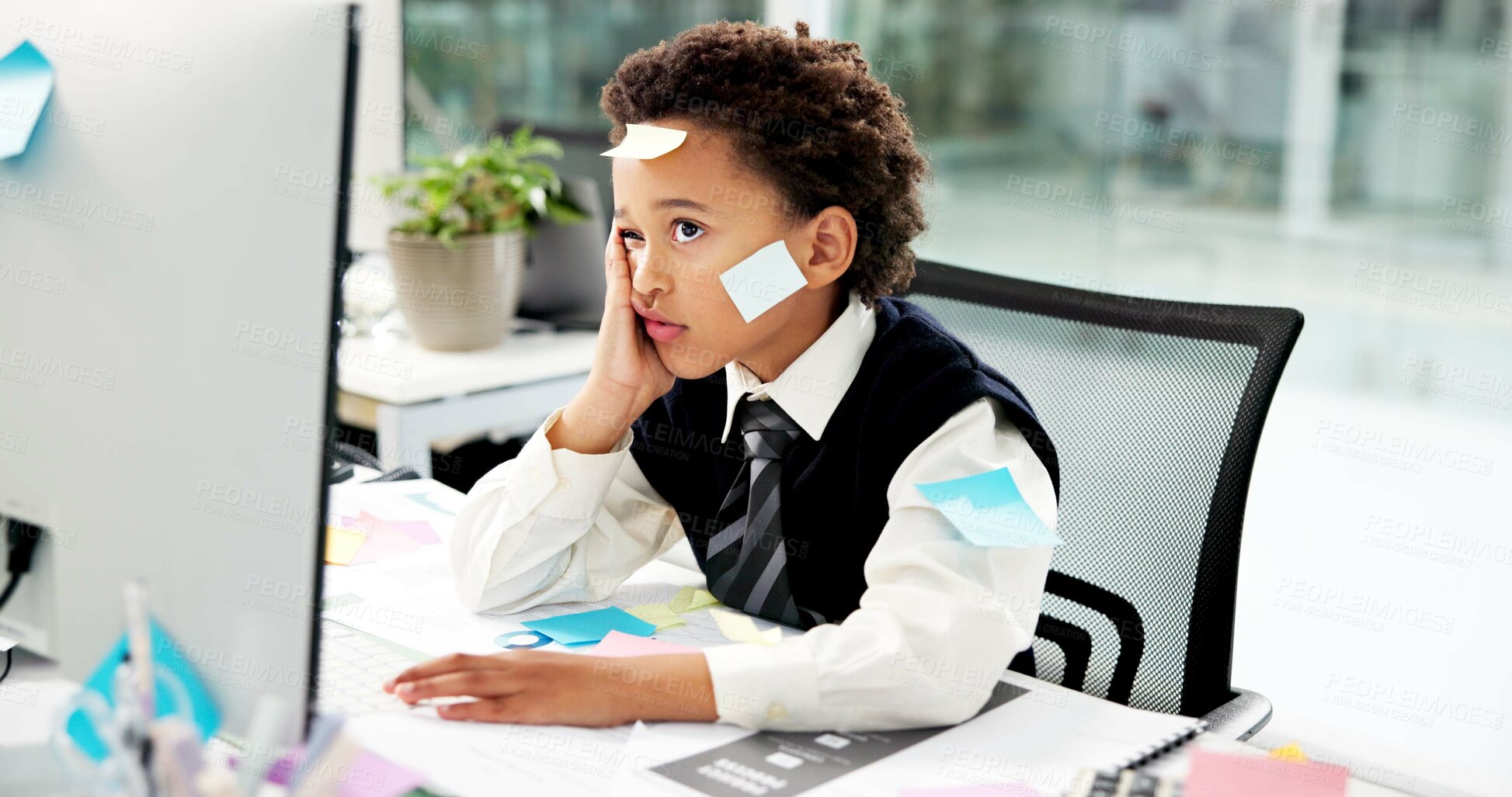 Buy stock photo Sticky notes, business kid and tired at computer for payroll deadline, crisis management and pretend. Role play, boy child accountant or bored in office for auditing, bookkeeping chaos and overworked