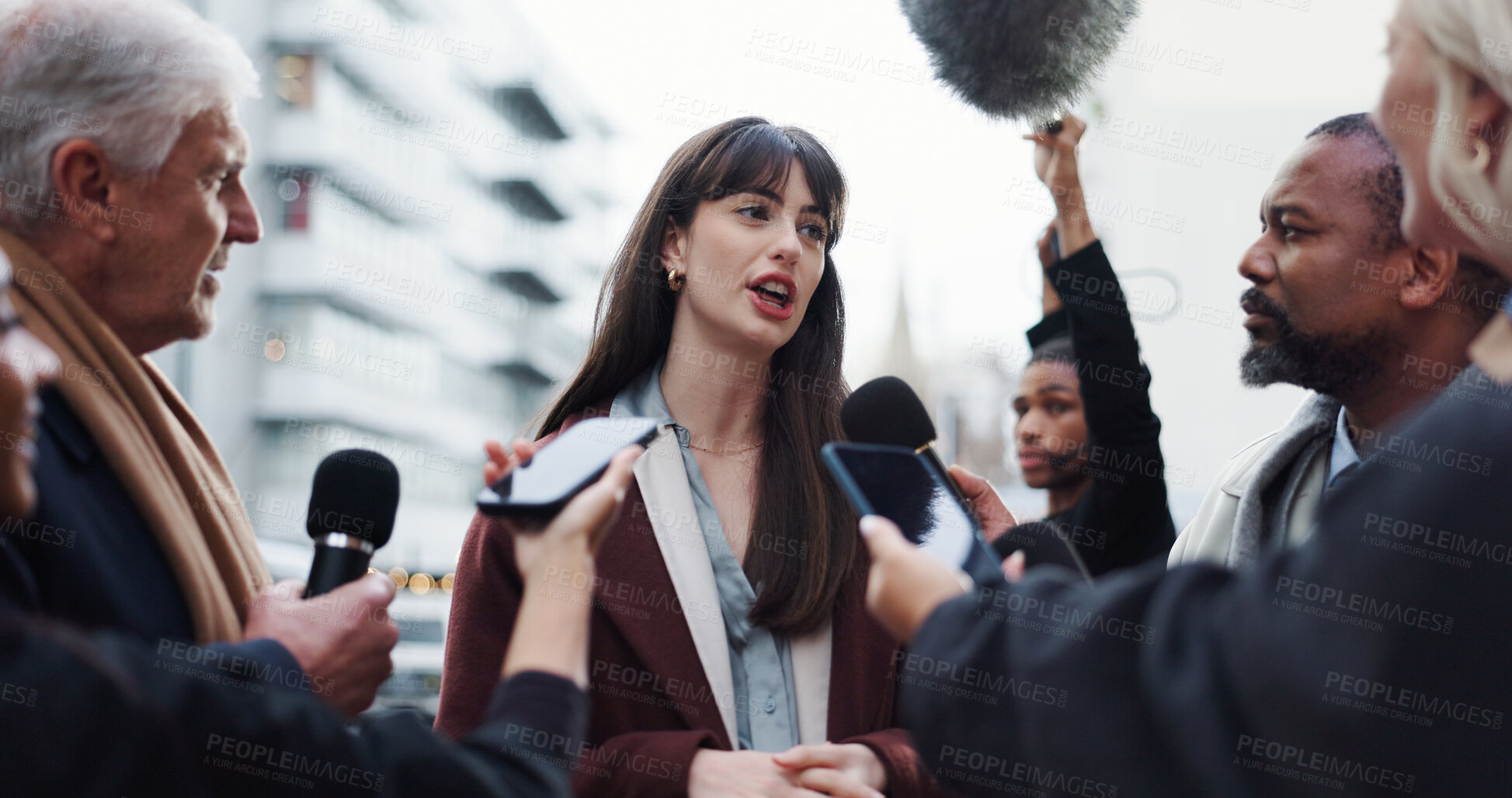 Buy stock photo Woman, spokesperson and talking to press, city and journalists with election questions or discussion. Government, representative and outdoor with reporters for campaign updates and people with mic