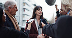 Woman, spokesperson and interview with press, city and journalists with election questions and talk. Happy, representative and outdoor with reporters for campaign updates, media and people with mic