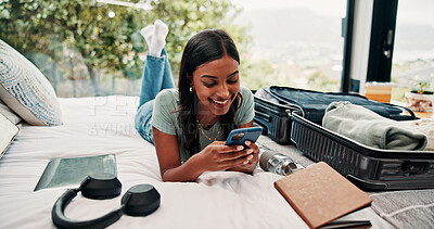 Buy stock photo Smile, phone and luggage with woman in bedroom for travel blog, social media and holiday post. Online booking, trip research and resort review with person and mobile in house rental for contact