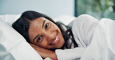 Buy stock photo Portrait, relax and smile of woman in bed for comfort, cozy or wellness on lazy weekend morning. Awake, break and travel with happy Indian person in hotel bedroom  for accommodation or hospitality