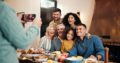 Buy stock photo Christmas, food and photograph with family at dining room together for celebration or memories. Festive, picture and smile of happy people at table in home for feast, social gathering or tradition