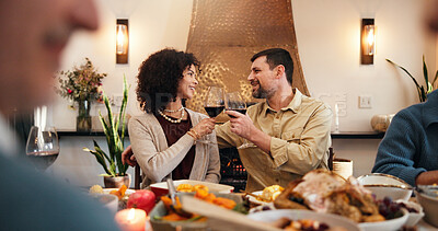 Buy stock photo Thanksgiving, wine and cheers with couple in dining room for festive feast, celebration and dinner. Toast, food and holiday season with man and woman in family home for reunion and tradition