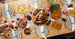 Above, table and turkey for thanksgiving at house with food layout, health vegetables and celebration. Candles, feast and cuisine setup with wine glass, nutrition meal and lunch tradition for festive