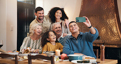 Buy stock photo Thanksgiving, family and selfie at dinner in home for party memory, online post and celebration. Festive lunch, happy people and photo at dining table for holiday reunion, profile picture and bonding