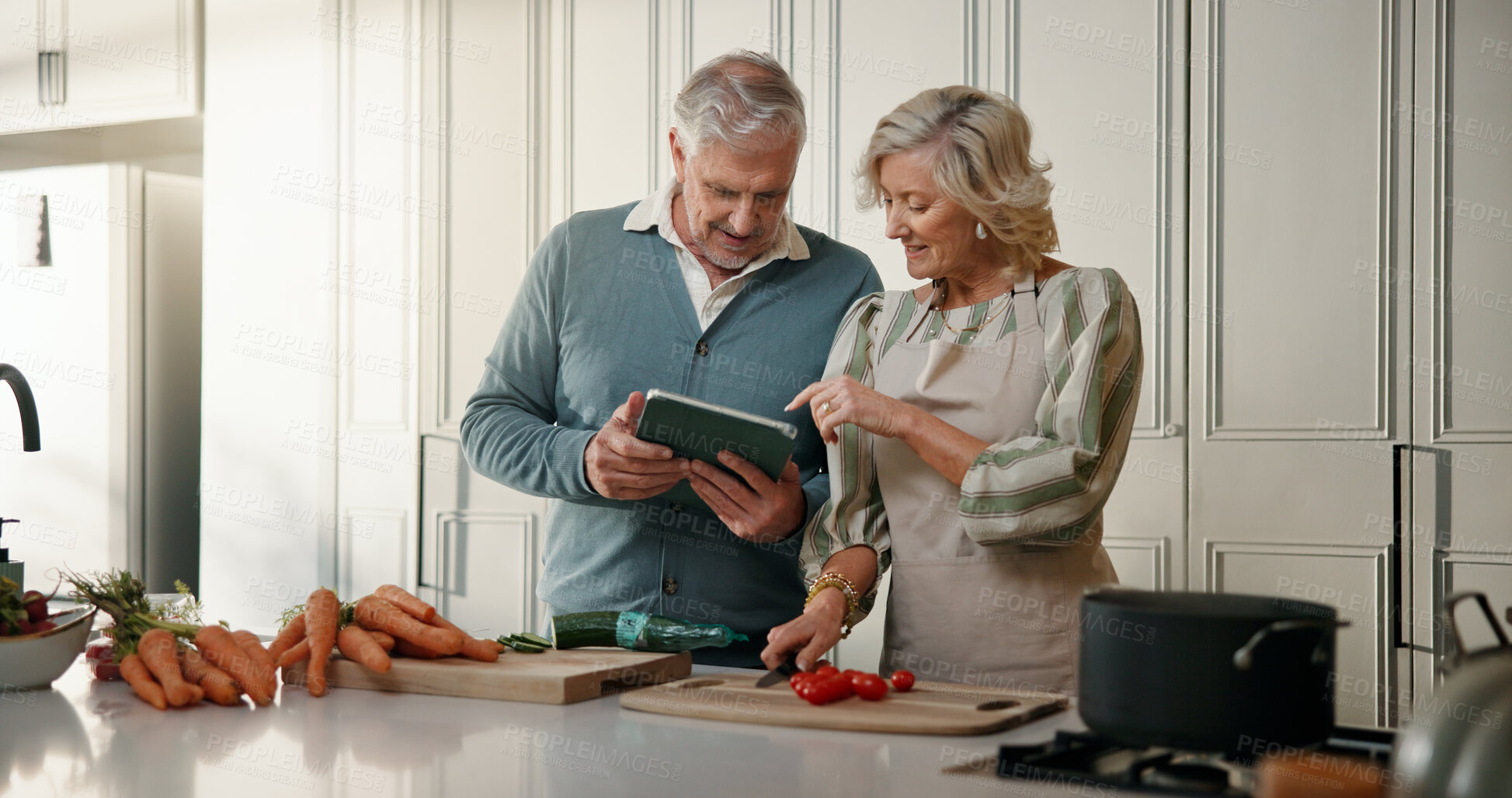Buy stock photo Senior, couple and tablet with food in kitchen for cooking recipe, online tutorial or tips in home. Man, woman or research with technology, ingredients or vegetables for meal guide or instructions