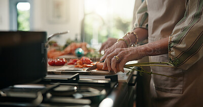 Buy stock photo Cooking, cutting and hands with old person in kitchen of home for healthy meal preparation. Busy, food and knife with senior woman chopping vegetables at counter in apartment for hunger or recipe