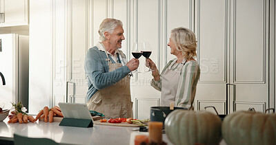 Buy stock photo Mature, happy couple and cheers with wine in kitchen for cooking, meal prep or celebration in home. Man, woman or smile with glasses, toast or ingredients for food, online recipe or dinner in house