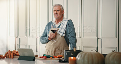 Buy stock photo Cooking, happy and senior man with wine for thanksgiving dinner, holiday or thinking of recipe. Elderly person, alcohol and smile in kitchen for meal prep inspiration, idea and retirement in home