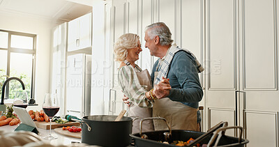 Buy stock photo Senior, happy couple and dancing with food in kitchen for fun cooking, meal prep or vibe in home. Elderly, man and woman with ingredients, vegetables or wine for bonding, romance or love in house