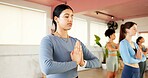 Group, woman and meditation for yoga in class with zen, spiritual awareness and holistic healing. People, namaste pose and inner peace with mindfulness practice, balance and session for mental health