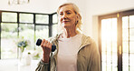 Senior woman, training and dumbbells in home with weightlifting, smile and exercise routine. Elderly person, fitness and strong with muscle development, workout and flare in retirement at apartment