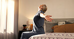 Wake up, stretching and woman in bedroom, morning and wellness with lens flare, relax and calm. Home, pensioner and mature person with muscle relief, resting and start day with peace and circulation