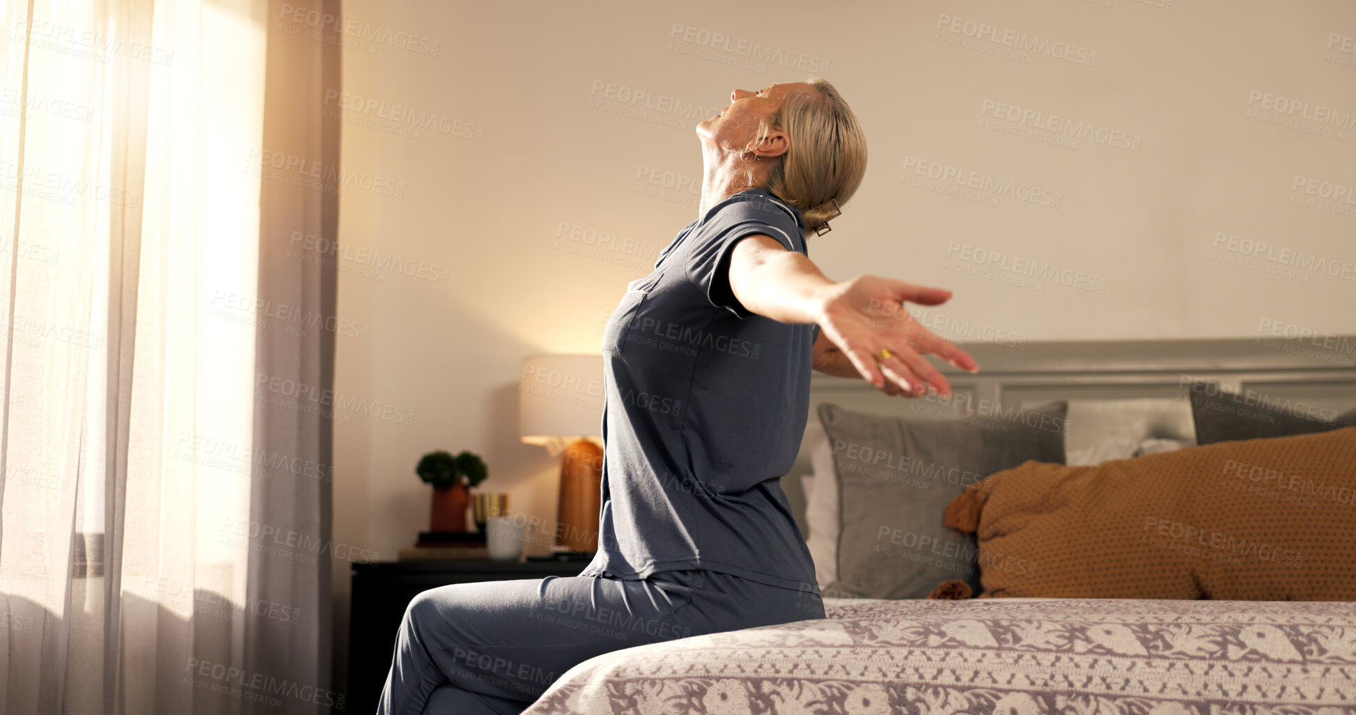 Buy stock photo Wake up, stretching and woman in bedroom, morning and wellness with lens flare, relax and calm. Home, pensioner and mature person with muscle relief, resting and start day with peace and circulation