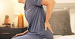 Home, back pain and old woman in bedroom, wake up and osteoporosis with joint injury. Closeup, pensioner and mature person with muscle tension, massage and body care with arthritis or fibromyalgia