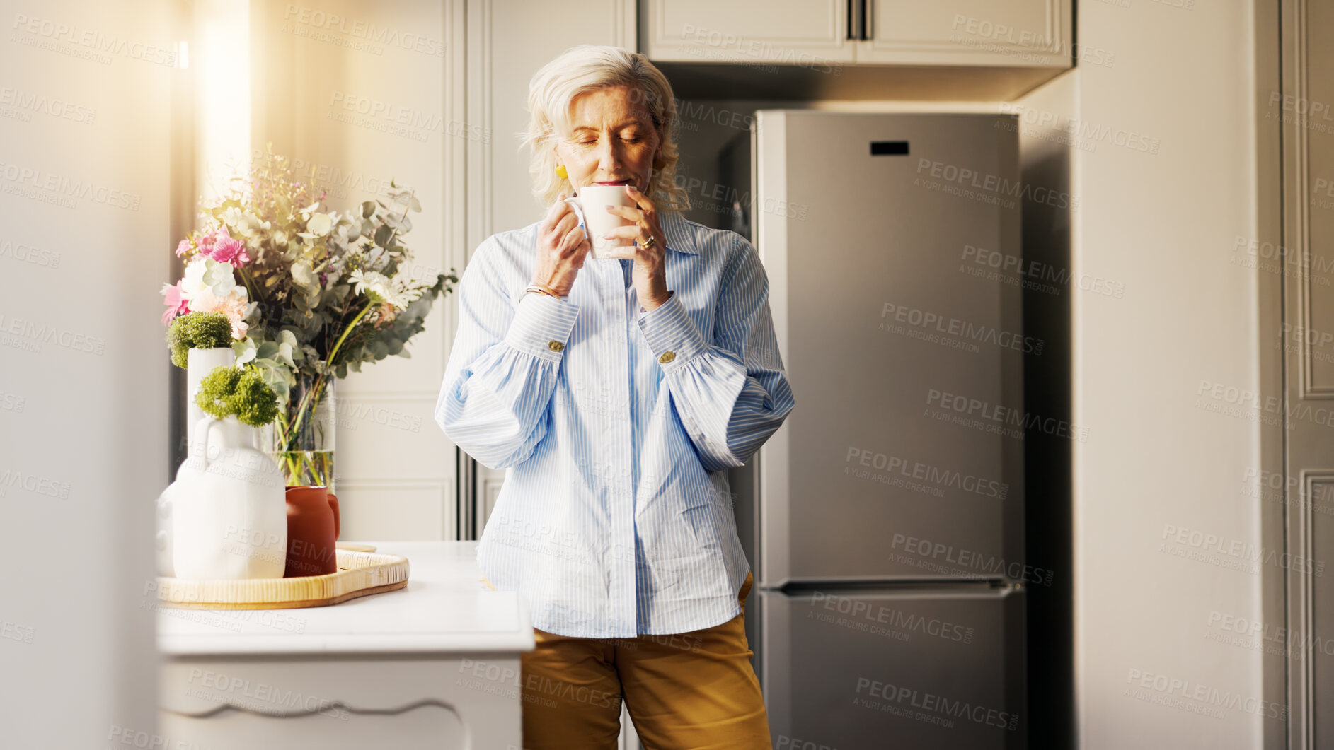 Buy stock photo Coffee, calm and senior woman by window in home for relax, peace and wellness in morning. Cappuccino, weekend and elderly female person drinking warm beverage in retirement for nostalgia in apartment