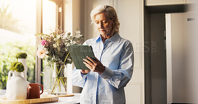 Buy stock photo Home, typing and senior woman with tablet, retirement and connection with social media. Apartment, pensioner and mature person with technology, internet and network with communication, app or texting