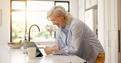 Buy stock photo Smile, senior woman and tablet in kitchen for research, social media and reading funny meme. Happy, elderly person and laugh with digital, comedy video and streaming online for entertainment at house