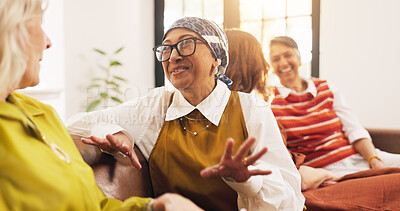 Buy stock photo Friends, gossip and old women on couch, home and happy for discussion, laugh and together in lounge. Senior people, conversation and humor for funny joke in living room, relax and break in apartment