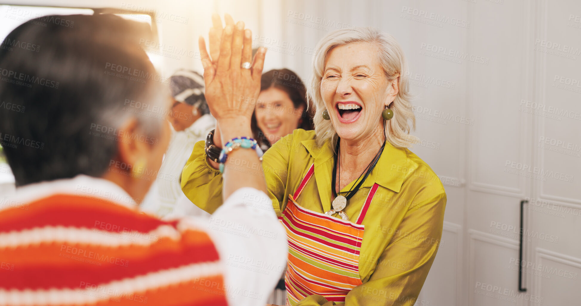Buy stock photo Cooking class, senior friends and high five in kitchen for recipe success, culinary skills and bonding. Retirement, old women and celebration for meal support, social reunion and hosting dinner party