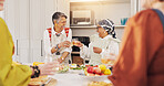 Cooking, kitchen and senior women with drinks for bonding, conversation and culinary lesson. Happy, social reunion and mature friends with cheers, toast and food for learning recipes together in home