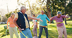 Senior people, park and exercise with hoop for active retirement, wellness class or laugh. Elderly friends, ring and fitness outdoor, funny joke or workout for balance with group for cardio health