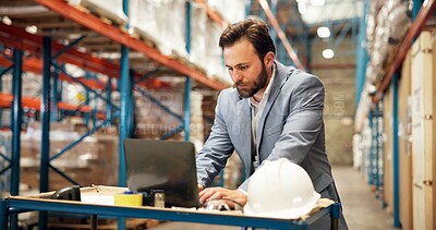 Buy stock photo Boss, man and typing in warehouse with laptop for shipping email, export and logistics communication. Manager, person and computer in storehouse for supply chain, distribution and delivery feedback.