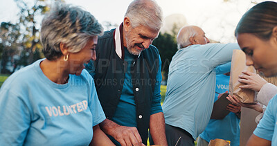 Buy stock photo Volunteer, park and people with packages for food drive, charity event and donation outdoor. Happy, teamwork and senior men and women helping for outreach program, community service and nonprofit