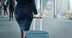 Suitcase, back and businesswoman in airport for travel with work trip by terminal gate. Journey, luggage and female corporate employee walking for international flight with conference for career.
