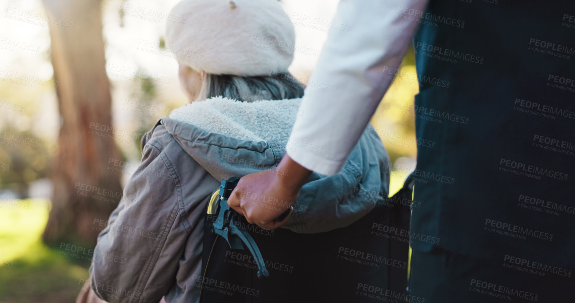 Buy stock photo Caregiver, walk or old woman with wheelchair for park, fresh air or nature for positive mental health. Retirement nurse, back or senior person with disability on outdoor stroll, wellness or support 