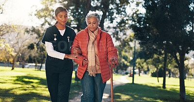 Buy stock photo Outdoor, caregiver and senior woman with walking stick, health and help for rehabilitation or trust. Physical therapy, nurse and support for elderly patient with arthritis, care and people in nature