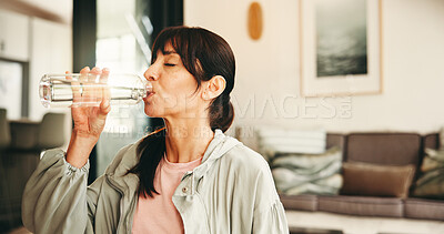 Buy stock photo Woman, fitness or drinking with water bottle in home for hydration, sustainability or recovery. Active, female person or thirst with mineral liquid or aqua beverage for rest or workout break in house