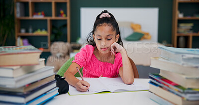 Buy stock photo Student, writing and child with homework, home and preparing for assignment, learning and knowledge. Studying, kid and girl with notebook for project, development and fine motor skills with education