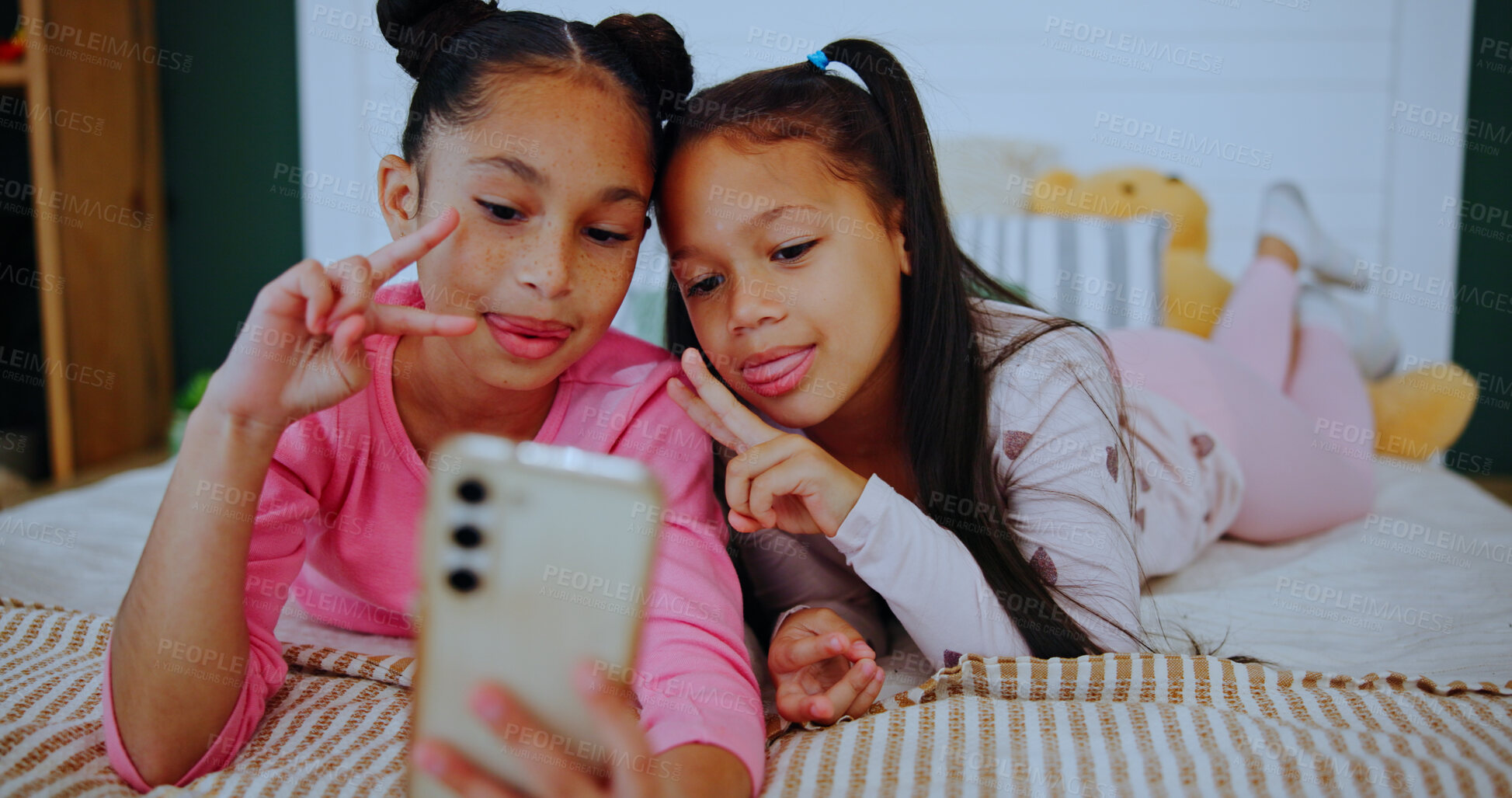 Buy stock photo Smile, children and relax with selfie on bed for photography, social media post and bonding together. Happy, girls and profile picture for family blog, siblings memory and weekend in home bedroom