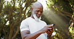 Mature black man, phone and fitness at park, smile and scroll with application for training outdoor. African person, runner and happy with smartphone, timer and stopwatch for exercise in nature