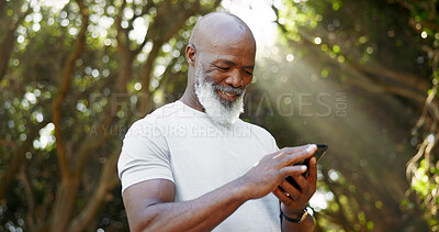 Buy stock photo Mature black man, phone and fitness at park, smile and scroll with application, notification and outdoor. African person, runner and happy with smartphone, timer and stopwatch for exercise in nature