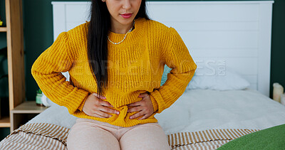 Buy stock photo Cramps, menstruation and woman in bedroom with massage, discomfort or stomach ache in symptoms. Health, pelvic pain or girl in house with belly rub, endometriosis or soothe abdominal tension on cycle