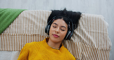 Buy stock photo Home, above and woman with headphones, relax and listening to music, sleeping and sound. Apartment, audio and person with break, resting and playlist album with radio, comfort and podcast with song