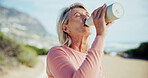 Fitness, drink water and senior woman with health, wellness and nutrition on break outdoor. Electrolytes, thirsty runner and person with bottle for hydration, exercise recovery and active retirement