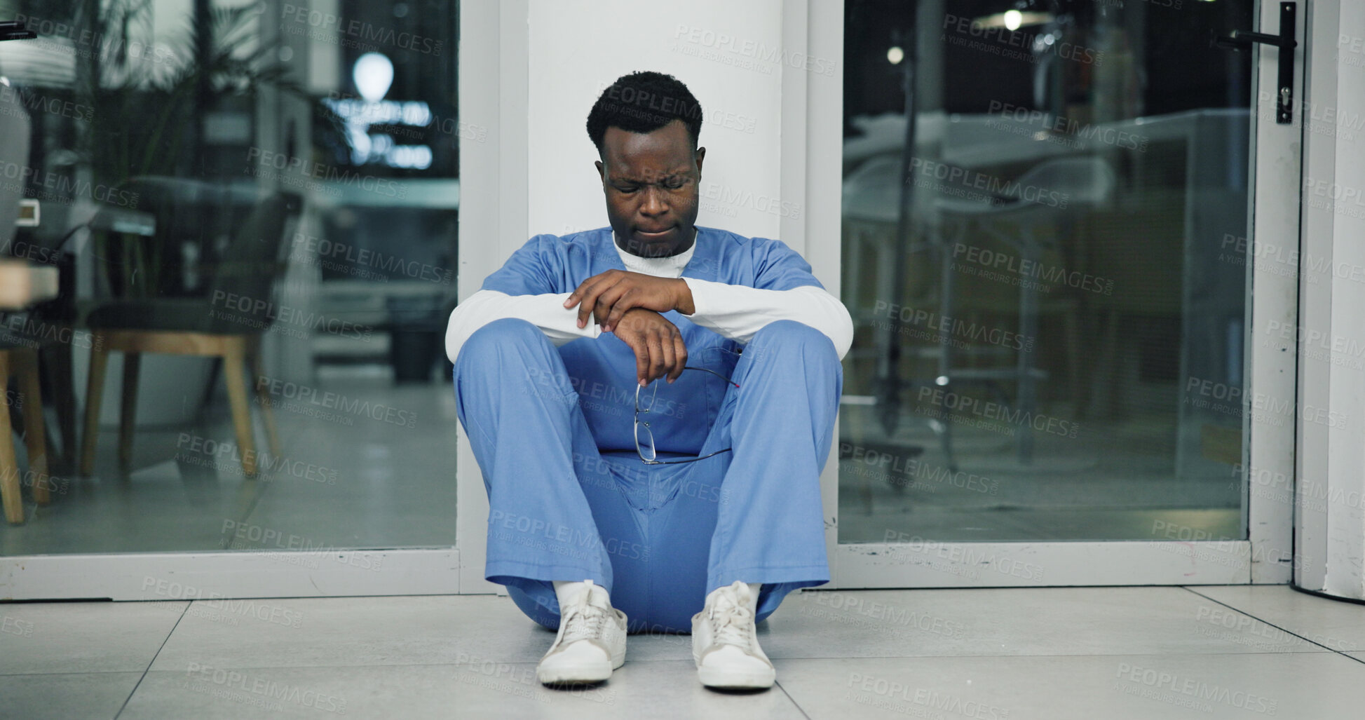 Buy stock photo Tension, black man and nurse in hospital with crisis, mistake or pressure for treatment plan. Stress, burnout and African healthcare worker with fatigue for negative report for patient in clinic.