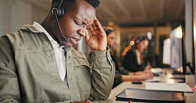 Buy stock photo Call center, customer service and man in office with headache from burnout, telecom or working overtime. Late, tired male person and migraine at night with client complaint, bad review or mistake